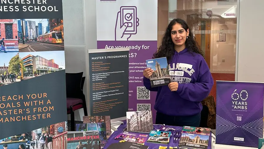 Sanjana Kukreja representing the school at a stall at a student fair.