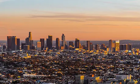 This sunset view from Griffith Park features the downtown Los Angeles skyline.