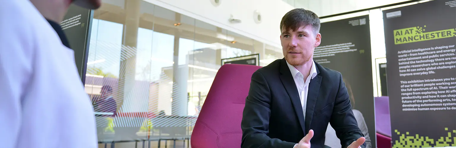 Tom Minnock sitting in Alliance MBS reception.