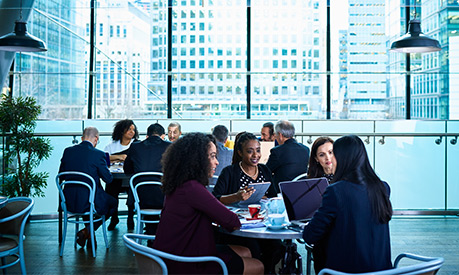 business meeting in a glass office building