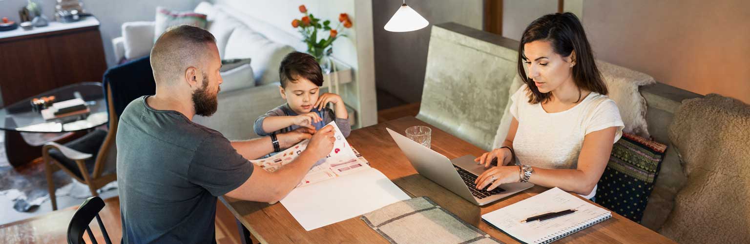 Couple working at home with a child
