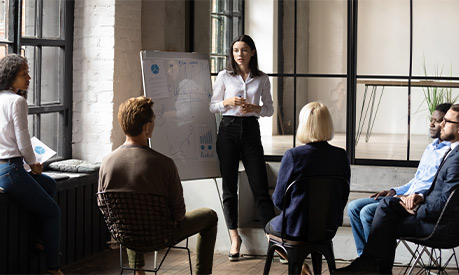 confident lady business trainer coach give flip chart presentation