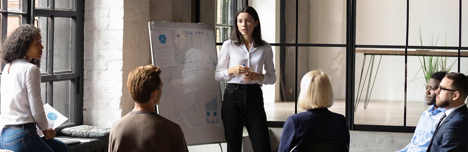 confident lady business trainer coach give flip chart presentation