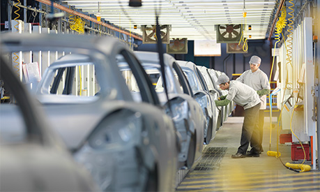 Workers in a car factory 