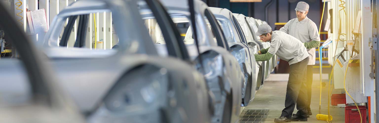 Workers in a car factory