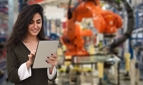 Woman using tablet in a factory