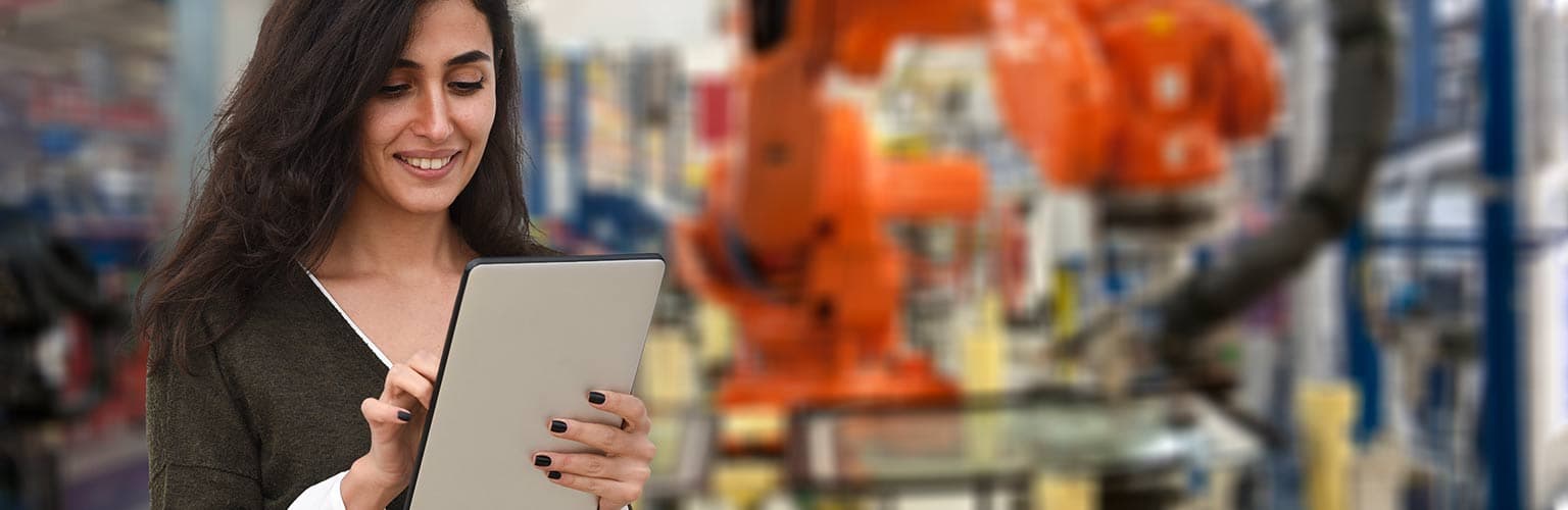 Woman using tablet in a factory