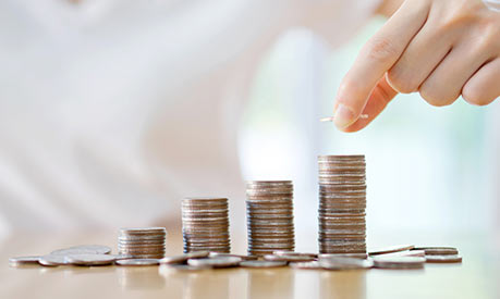 hand stacking coins