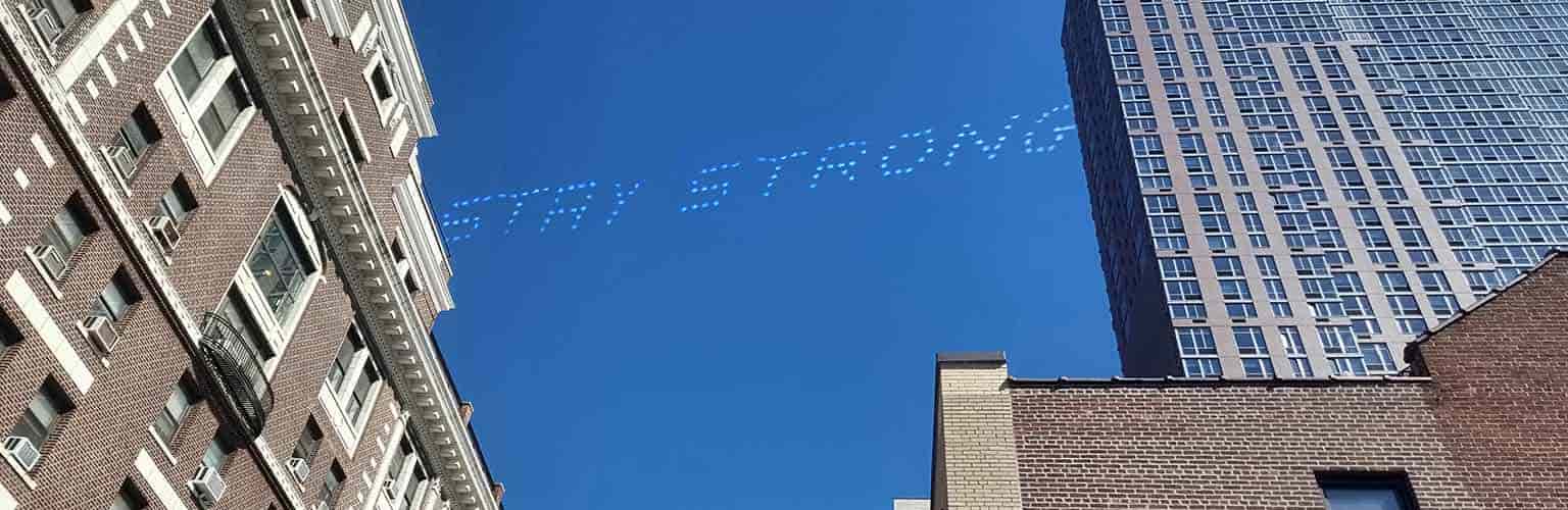 stay strong written in the sky over a city