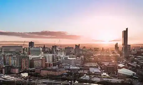 Manchester cityscape at sunset