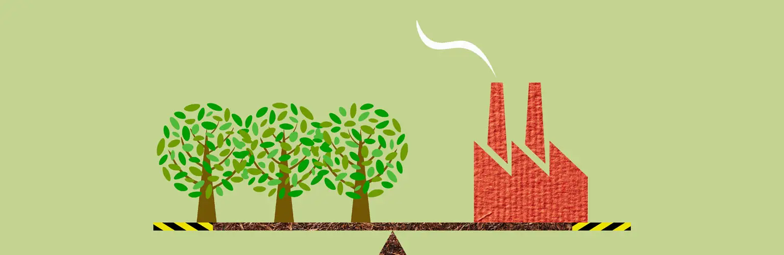A graphic of three trees and a factory balanced on a seesaw
