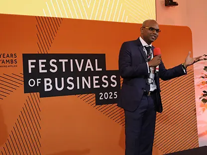 A man presenting on stage at the Festival of Business 2025.