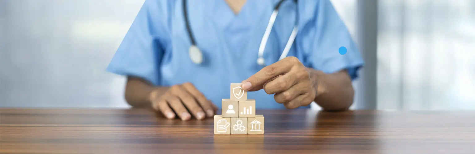 Hand arranging wood block with healthcare medical icon