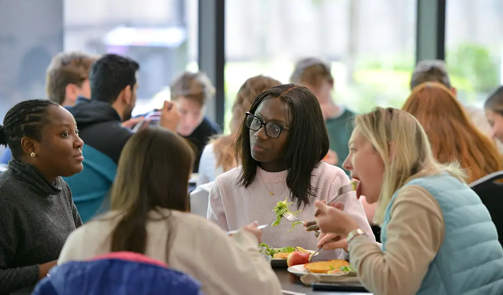 A group of four delegates having lunch together.