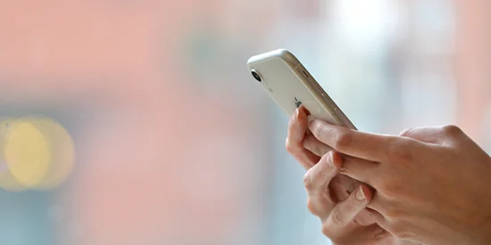 Hands holding an phone