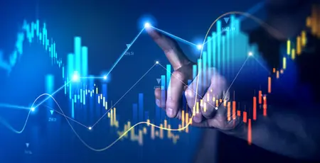 A finger pointing at a graphic of a digital graph.