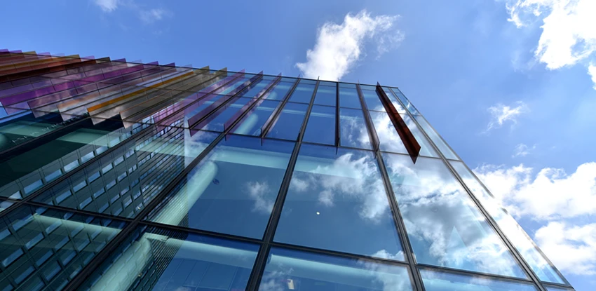 Image of the Alliance Manchester Business School building and blue sky.