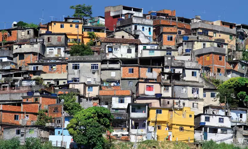 A favela during a sunny day with a clear blue sky