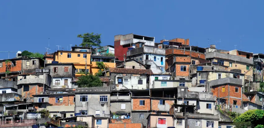 A favela during a sunny day with a clear blue sky