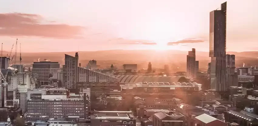 A cityscape shot of the Manchester city centre during a sunset