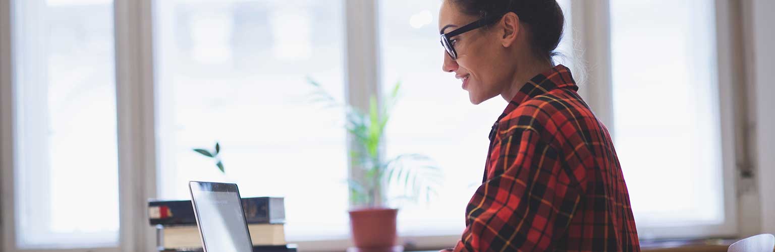 Female student looking at a laptop