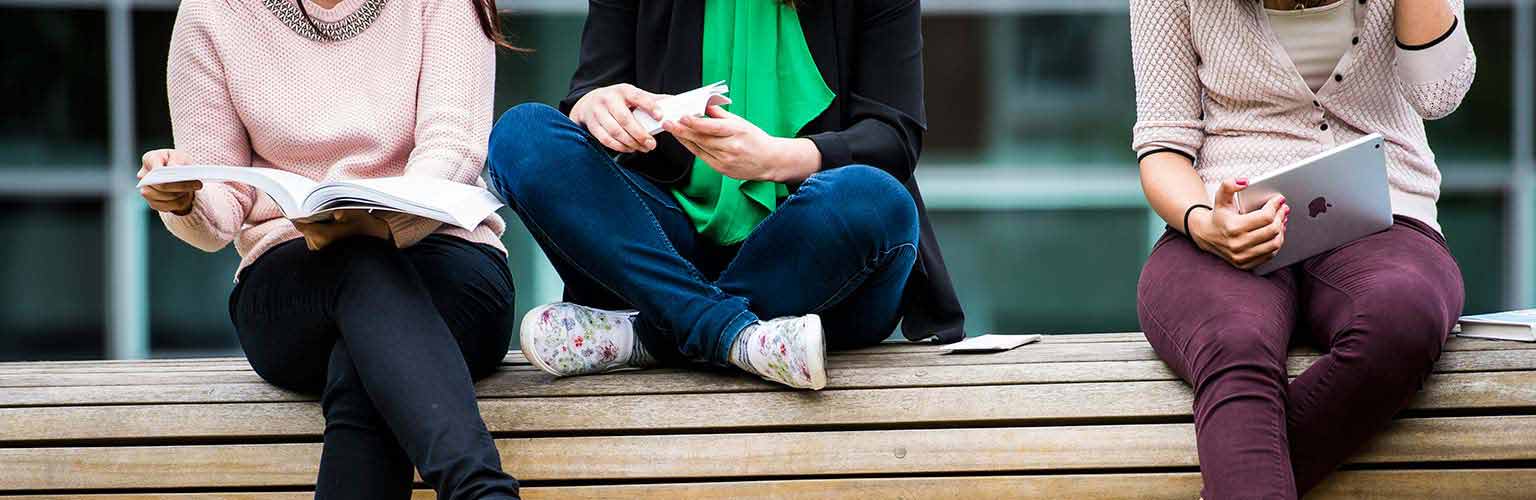 3 students sat on a bench