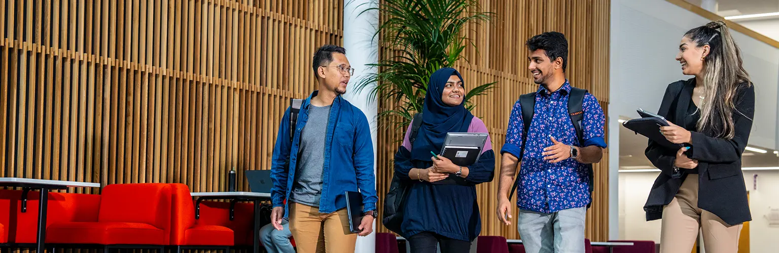 Alliance MBS master's students walking together on campus.