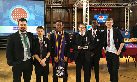 students celebrating success at the annual stock market challenge