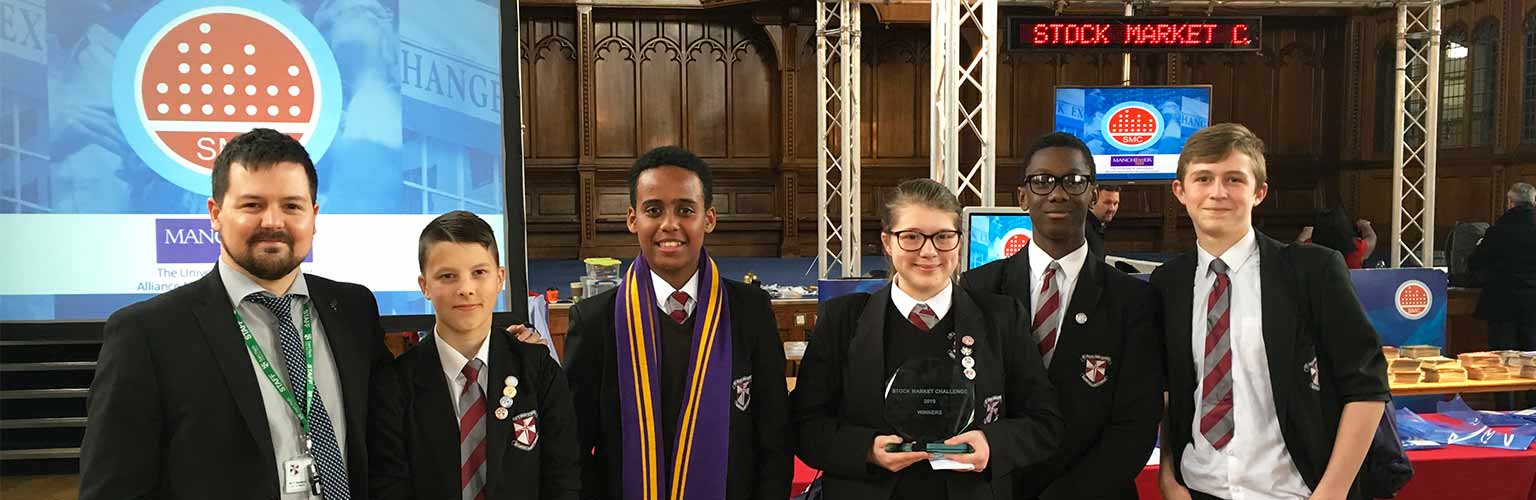 students celebrating success at the annual stock market challenge