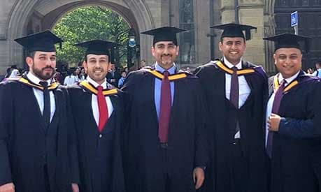 Group of male MBA graduates