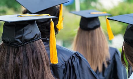 a view of graduation with students in graduation caps