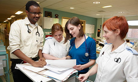 A group of healthcare professionals looking at data