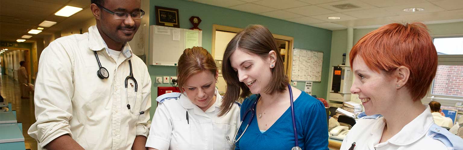 A group of healthcare professionals looking at data