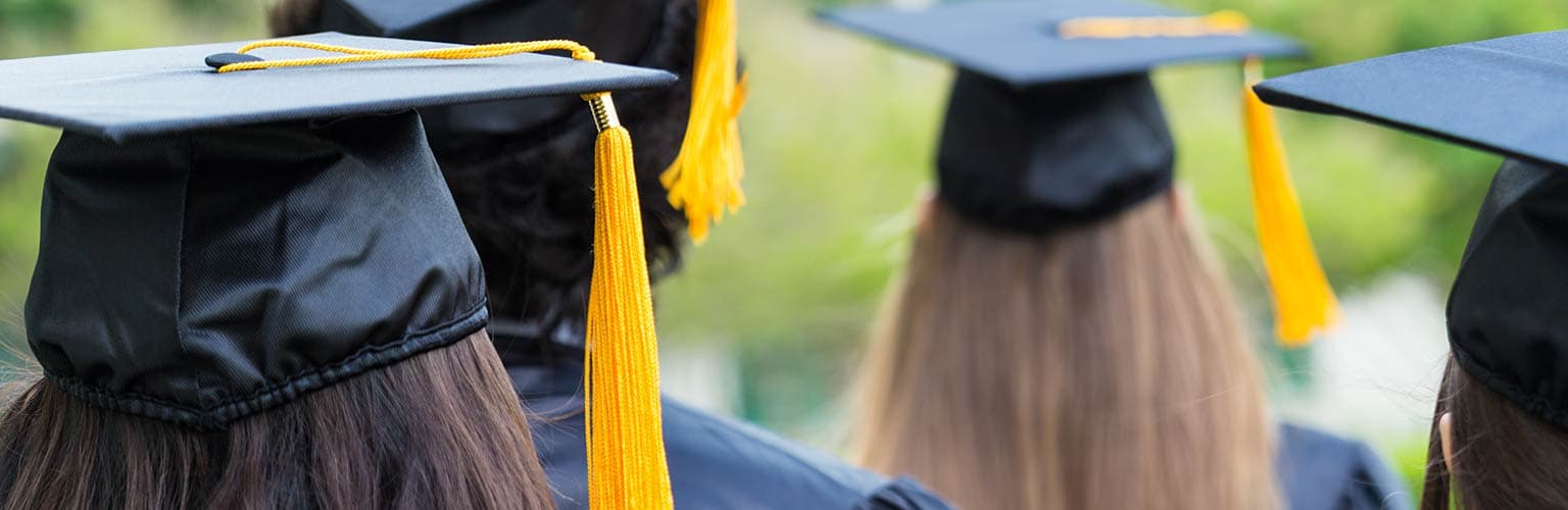 a view of graduation with students in graduation caps