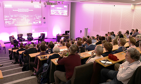 a lecture theatre packed with people for a vital topics event