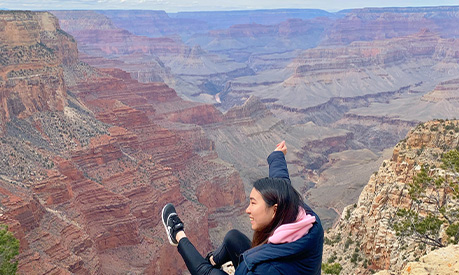a student overlooking the grand canyon