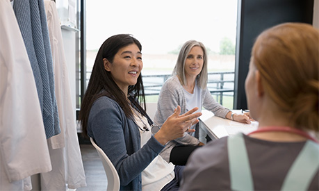 a meeting with healthcare leaders in a boardroom