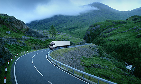 A lorry driving on a rural road