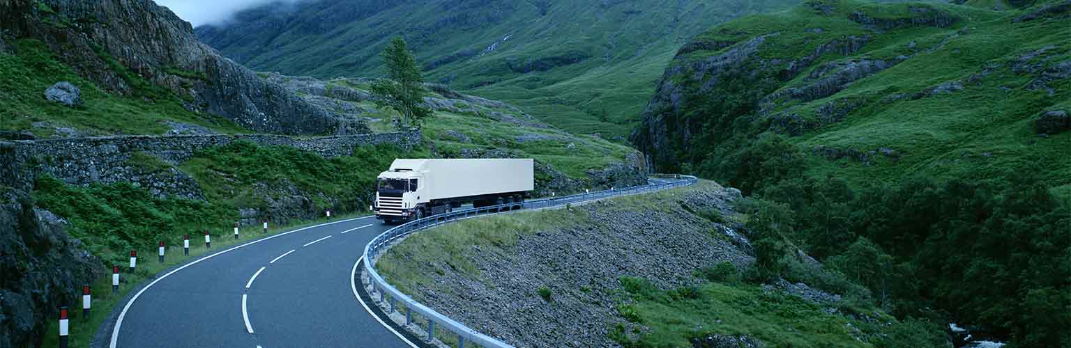 a lorry driving on a rural road