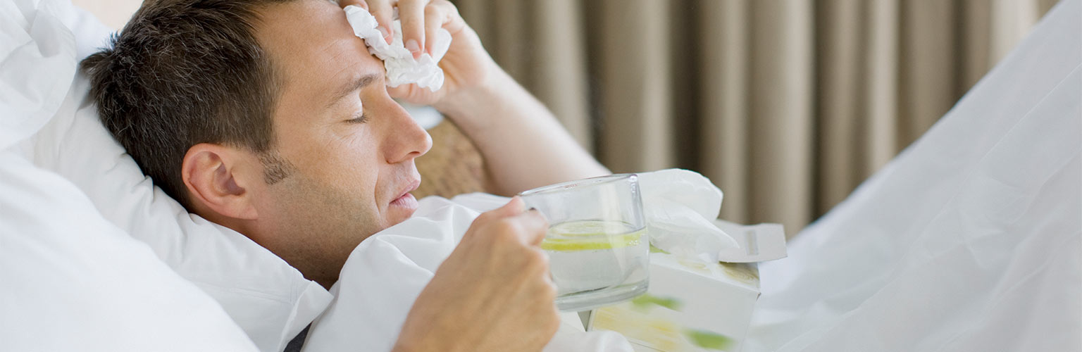 man in bed with illness 