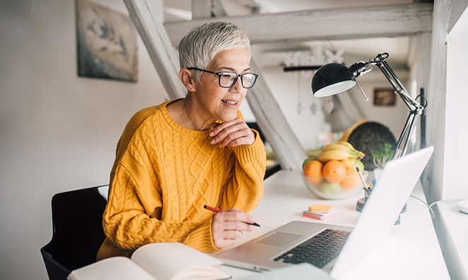 A woman sitting at a laptop