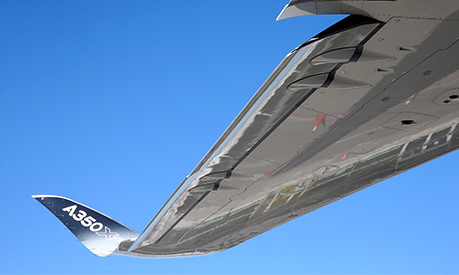 a view of a plane's wing from the sky