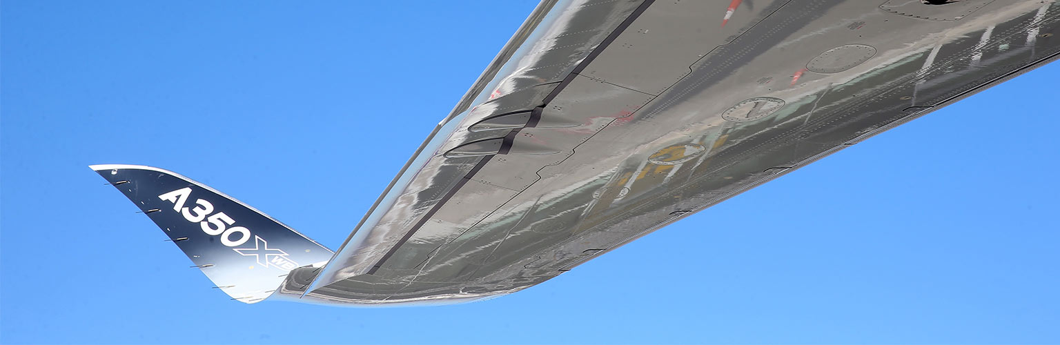 a view of a plane's wing in the sky