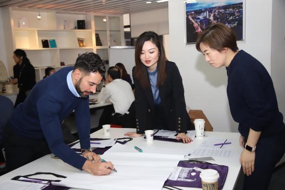 Three students working together on a project