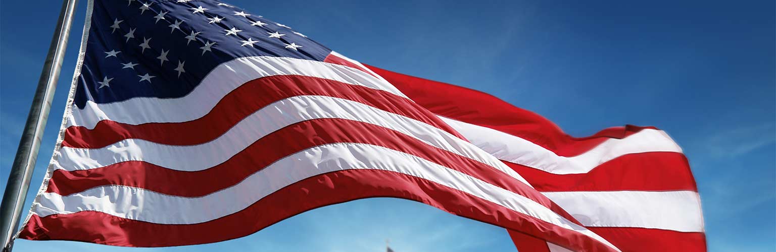 united states of america flag with the white house in the background