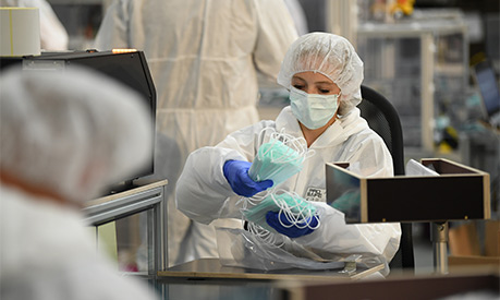 a factory producing protective face masks for covid-19