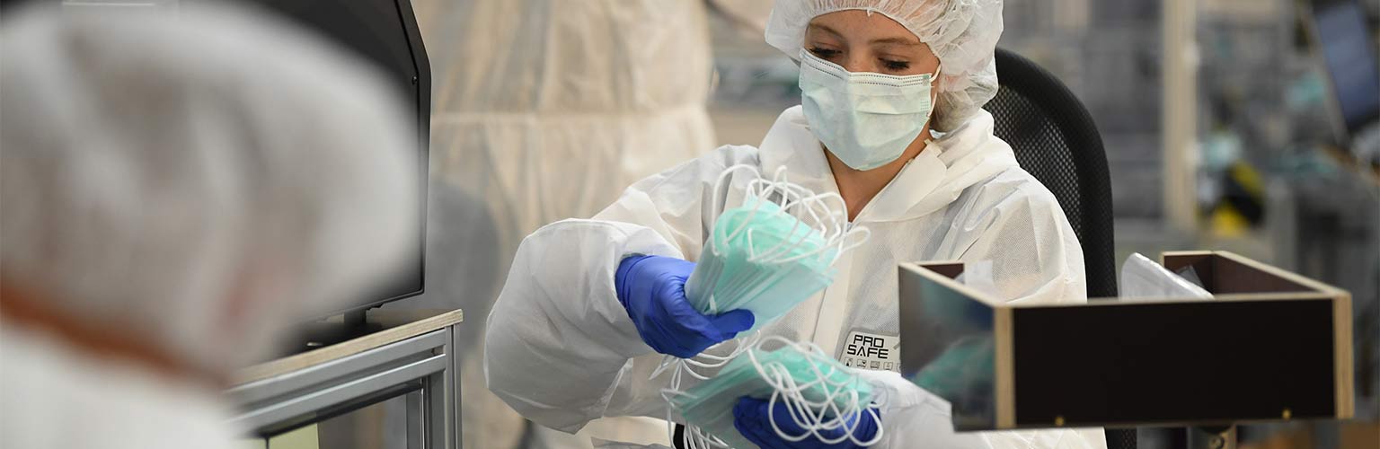 a factory producing protective face masks for covid 19