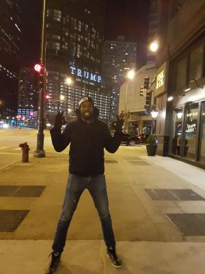 Male MBA student in front of skyscraper