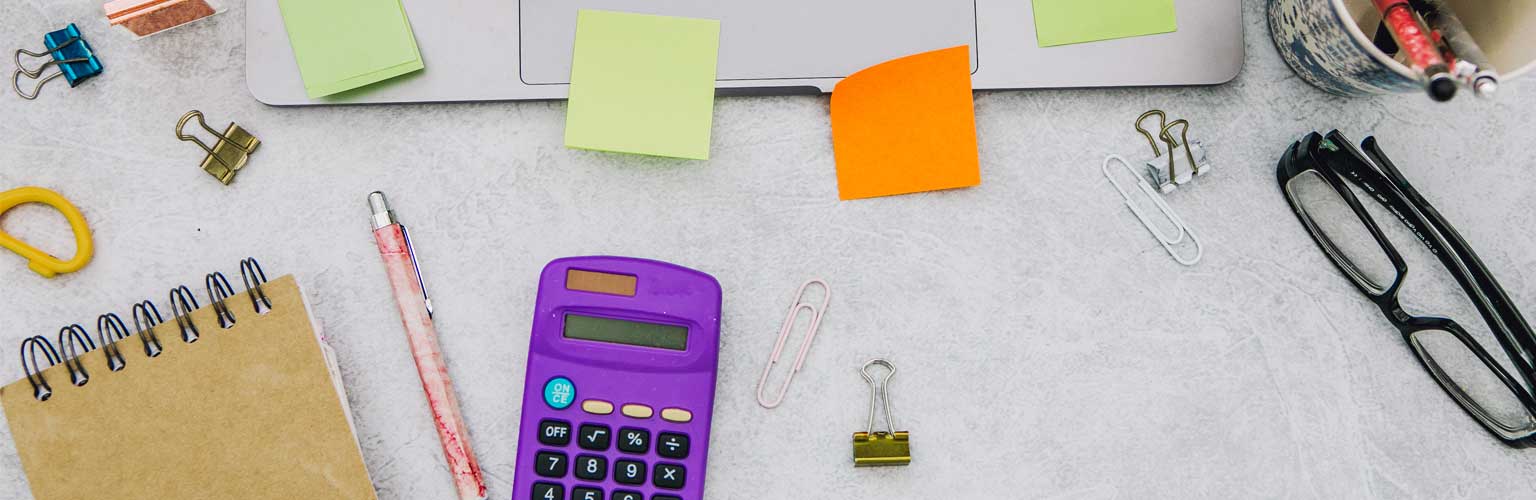 stationary and laptop on a desk