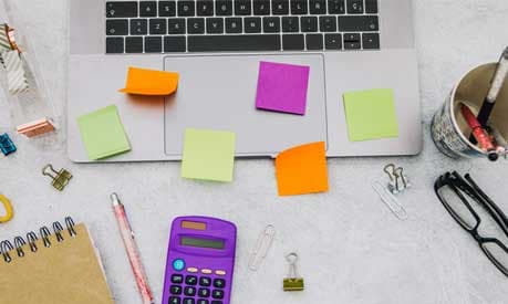 stationary and laptop on a desk